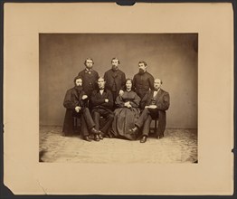 Group portrait of men and woman, about 1860-1869. Creator: Unknown.