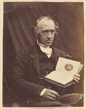 Portrait of Seated Man with a Book, 1870-1875. Creator: Unknown.