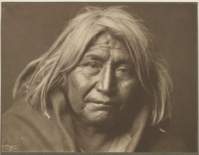 An Apache, 1903. Creator: Edward Sheriff Curtis.