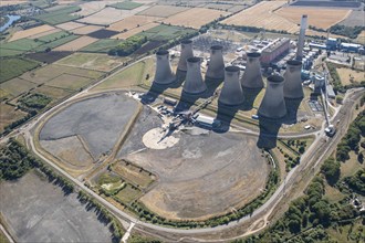 The cooling towers and disused coal stocks at Cottam Power Station, Nottinghamshire, 2022. Creator: Emma Trevarthen.