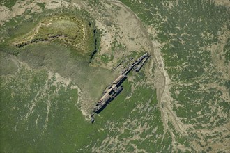 The remains of a surrendered First World War German submarine in Stoke Saltings, Medway, 2024. Creator: Damian Grady.