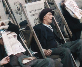 Close up on a Man in a Flat Cap and With a Neckerchief Sleeping in a Deck Chair on the Prom..., 1938 Creator: British Pathe Ltd.