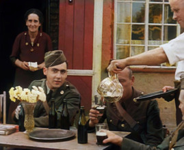 American Airmen Drinking Outside a Public House in England, and Being Served by..., 1943-1944. Creator: British Pathe Ltd.