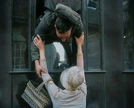 Male Soldier Kissing Female Civilian from the Window of a Train, 1929. Creator: British Pathe Ltd.