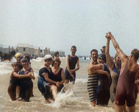 Civilians Wearing Swimsuits Enjoying a Sunny Day Dancing at a Very Crowded Beach, 1920. Creator: British Pathe Ltd.