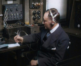 Italian Senator Guglielmo Marconi Using Radio Apparatus While Taking Notes, 1920. Creator: British Pathe Ltd.