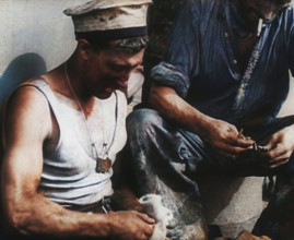 British Soldier Counting Bullets on Board a Ship Evacuating Him from Dunkirk, 1940. Creator: British Pathe Ltd.