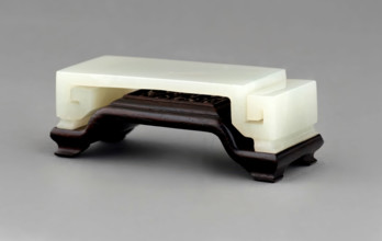 Wrist rest with wood stand. Creator: Unknown.