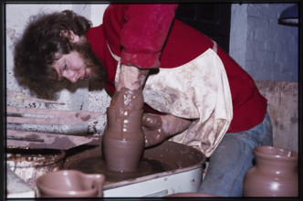 A potter working at a wheel in the Gladstone Pottery Museum, Longton, Stoke-on-Trent, 1975.