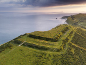 Flower's Barrow, East Lulworth, Dorset, 2024. Oblique aerial view of the hillfort from the