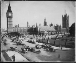 Traffic passing the Palace of Westminster on Parliament Street and Parliament Square, as seen from