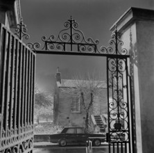 Detail of the wrought iron gate and overthrow at the Old Hall, Highgate, London, 1967; with the