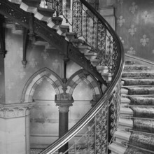Interior detail showing the iron balustrades of the grand staircase in the Midland Grand Hotel at
