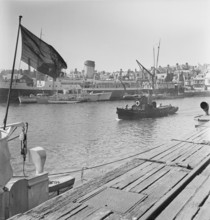 A view of the harbour at Weymouth showing various vessels including SS St Julien, 1948. This image