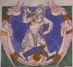 Amos, 1148. Beginning of the Book of Amos. Initial 'V', Amos blowing a horn, and carrying a club,