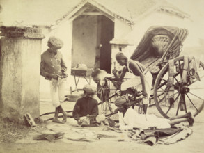 Four men and a rickshaw, India, 1873. Two are playing cards. The man on the right holds a chillum,