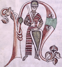 Knight with sword and shield, 12th-13th century. He wears a long-sleeved hauberk (coat of