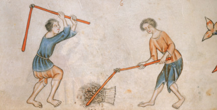 Two men beating corn with flails, c1325-c1335. Two barefoot men with flails thresh a sheaf of corn.