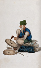 A man making grindstones, (between 1800 and 1899?). Creator: Unknown.