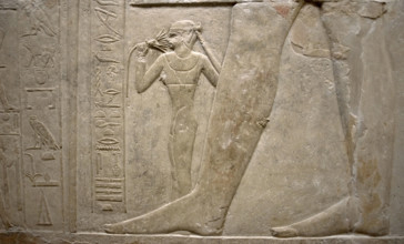 Relief of legs of Mereruka with his wife Watetkhethor..., Mastaba of Mereruka, Egypt, 2003.   Creator: Unknown.