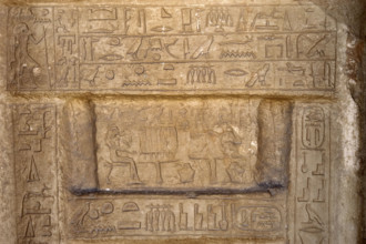 Hieroglyphic writing and deceased ofering food to the gods, Necropolis of Saqqara, Egypt, 2003. Creator: Unknown.
