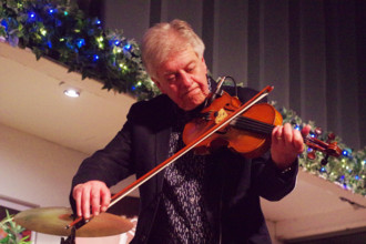 Mike Piggott, East Grinstead Jazz Club, Apron Café, Chequer Mead Theatre, West Sussex, April 2025. Creator: Brian O'Connor.