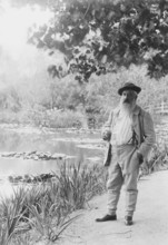 Claude Monet near the Water Lily Pond, 1905. Creator: Bulloz, Jacques-Ernest (1858-1942).