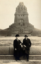 Georg Sticker and an unknown companion, in front of a war memorial (?). Creator: Unknown.