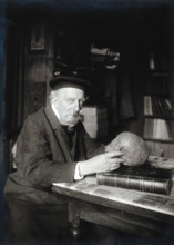 Adrien de Mortillet, holding a skull. Creator: Unknown.
