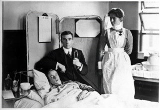 Charing Cross Hospital: Basil Hood with patient, 1904. Creator: Unknown.