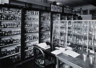 The Wellcome Building, Euston Road, London: working area in the materia medica stores, c1930s.. Creator: Unknown.