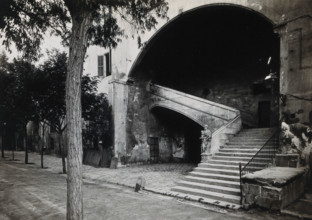 Hospital de la Santa Cruz, Barcelona: a staircase leading up to the men's department... Creator: Unknown.