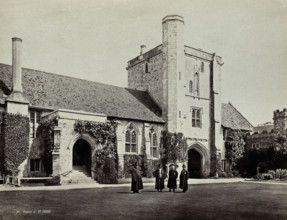 Hospital of Saint Cross, Winchester: four men standing in the courtyard, between 1800 and 1899. Creator: Unknown.