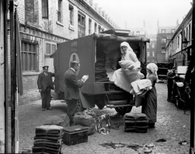 Ambulance Column depot, 9 Gower Street, London: loading up the blanket bus in Gower Mews, 1918. Creator: Unknown.