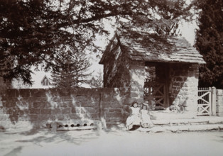 Mitchel Troy, Wales: lich-gate and stocks outside the church, c1890. Creator: Unknown.