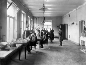 IP Pavlov and students in the vivisection room, Physiology Department at the Imperial..., [1904]. Creator: Unknown.