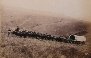 South Africa: landscape with people, a wagon and oxen in the foreground, 1896. Creator: Unknown.