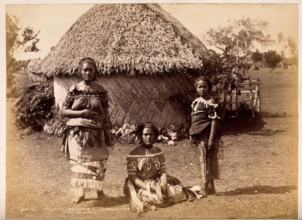 Nuku'alofa, Tonga: three Tongan women in front of a traditional hut, c1870s. Creator: Burton Brothers.