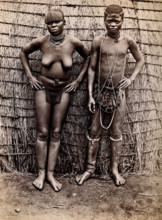 Africa: an African woman and man in front of a kraal hut, 19th century. Creator: Unknown.