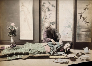 A Japanese woman being massaged by a blind Japanese masseur, c1890s. Creator: Unknown.