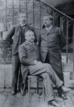 Charles Sherrington (left), Leon Fredericq (seated) and Paul Grützner (right) outside the...(1940?). Creator: Unknown.