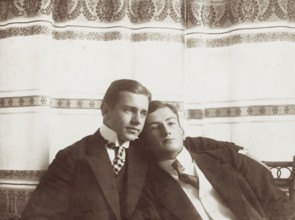 Two men resting close to one another, wearing formal attire, 1910. Creator: Unknown.
