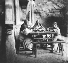 Fangguangyan monastery, Fujian province, China: three monks at the meal table, 1870-18711. Creator: John Thomson.
