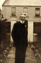 An unidentified man, standing in a garden, c1900. Creator: Unknown.