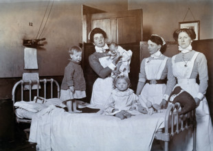St Bartholomew's Hospital, London: nurses and children in casualty, c1890. Creator: Unknown.