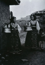 Two Bulgarian women with a child wearing national dress, c1900. Creator: Unknown.