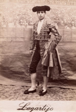 A bullfighter, Rafael Molina Sanchez "Lagartijo", posing in front of a painted back..., c1870s. Creator: Unknown.