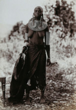 A young Masai woman, full length, wearing much jewellery, 1900. Creator: Unknown.