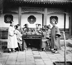 Peking, Pechili province, China: Manchu ladies at a meal table, 1869. Creator: John Thomson.