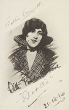 An man in drag as "Gertie" wearing a checked coat, 1916. Creator: Unknown.